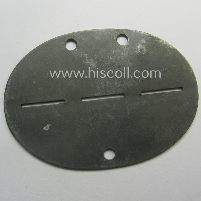 Zinc-based, WH (Heeres) 'Gebirgsjäger-Nachrichten'-related ID-disc bearing the clearly stamped unit-designation that reads: 'Geb.Nachr.E.Battr. 111' and that comes as issued and/or worn