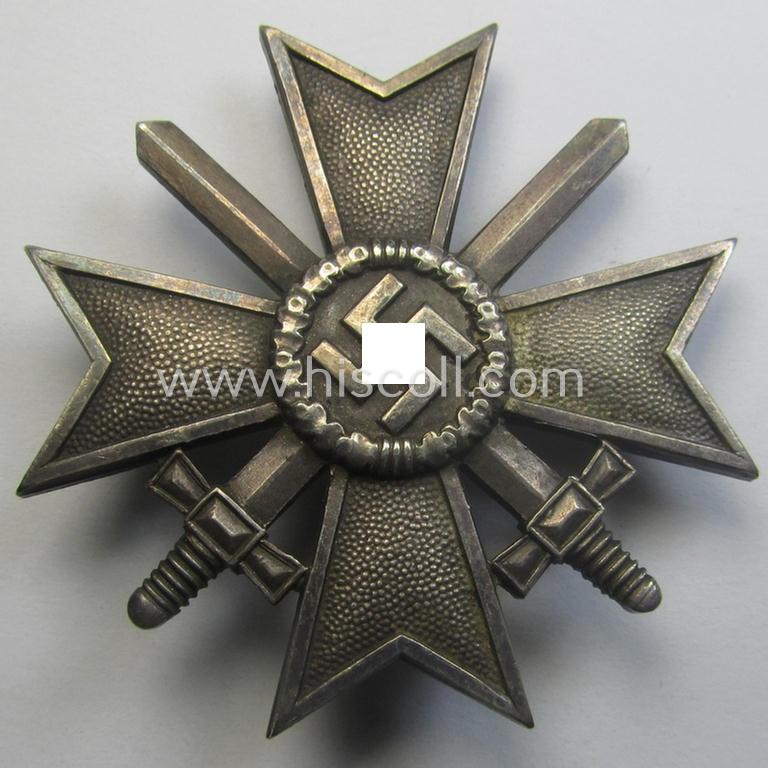 'Kriegsverdienstkreuz 1. Klasse mit Schwertern' as executed in typical, silverish-coloured metal (ie. 'Buntmetall') being a clearly maker- (ie. '1'-) marked specimen by the desirable maker: 'Deschler & Sohn'