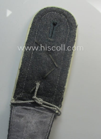 Attractive - albeit regrettably single! - WH (Luftwaffe) NCO-type shoulderstrap as piped in the desirable white-coloured branchcolour as was intended for an: 'Oberfeldwebel u. Offz.-Anwärter der Hermann Göring-Div.'