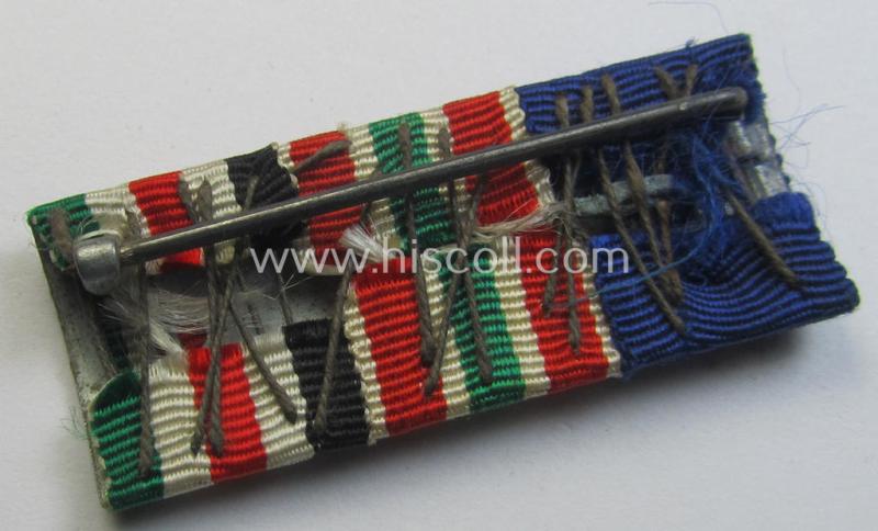 Neat, 3-pieced medal-bar (ie. 'Band- o. Feldspange') showing resp. the ribbons for a: 'WH (Heeres) D.A. der 4. Stufe', a: WH Memelland 'Anschluss'- (ie. occupation-) medal: '22 März 1939' and a: 'Deutsch-Italienische Feldzugsmedaille'