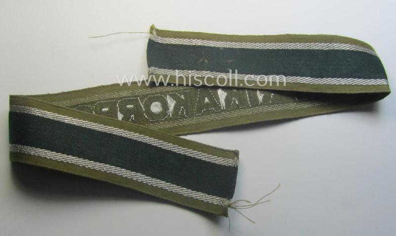'BeVo'-like cuff-title (ie. 'Ärmelstreifen') entitled: 'Afrikakorps' being a presumably issued but simply never worn example that comes in an overall very nice- (ie. non-shortened- and never tunic-attached-), condition