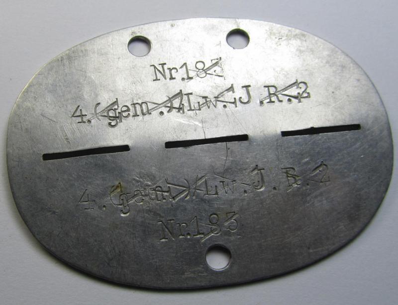 Attractive, aluminium-based WH (Heeres, LW usw.) ie. 'Schützen'-related ID-disc (ie. 'Erkennungsmarke') bearing the clearly stamped unit-designation that reads: '1.gem.Schütz.Kp. 302' and that comes as issued- and/or worn