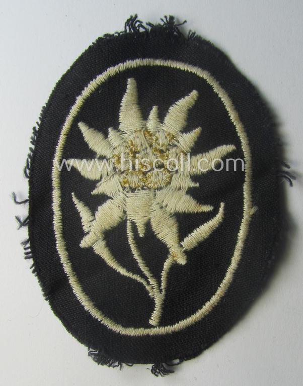 Waffen-SS-pattern, black-coloured sleeve-insignia (ie. 'Ärmelabzeichen') depicting an: 'Edelweiss'-flower as used by the various 'Gebirgsjäger'- (ie. mountain-troops-) related divisional-staff