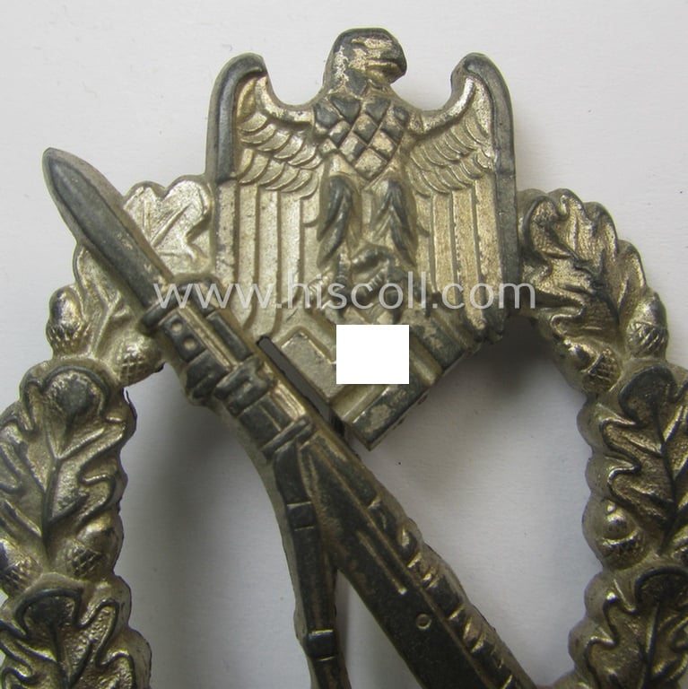 'Infanterie Sturmabzeichen in Silber' being a maker- (ie. 'W.H.'-) marked and/or quite converse, 'solid-back' example by the Austrian-based maker: 'Wilhelm Hobacher' as was executed in bright silver-coloured, zinc-based metal