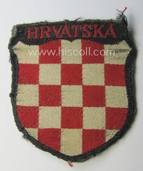 Truly used- and/or worn, multi-coloured- and/or 'BeVo'-woven armshield...