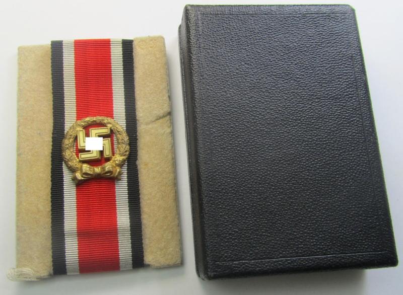 'Ehrenblattspange des Heeres' (or: army honour-roll clasp) being a 'Buntmetall'- (ie. 'Tombak'-) based example by the maker (ie. 'Hersteller') 'Otto Klein & Co.' that comes in its rarely seen black-toned etui