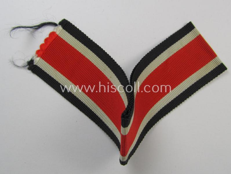 Neat spare-part: a non-confectioned- (ie. full length- ie. 29 cms. long-sized-) ribbon (ie. 'Bandabschitt') as was intended for the: 'Eisernes Kreuz II. Klasse' and that comes in an overall very nice- (ie. 'virtually mint ie. unissued'-), condi...
