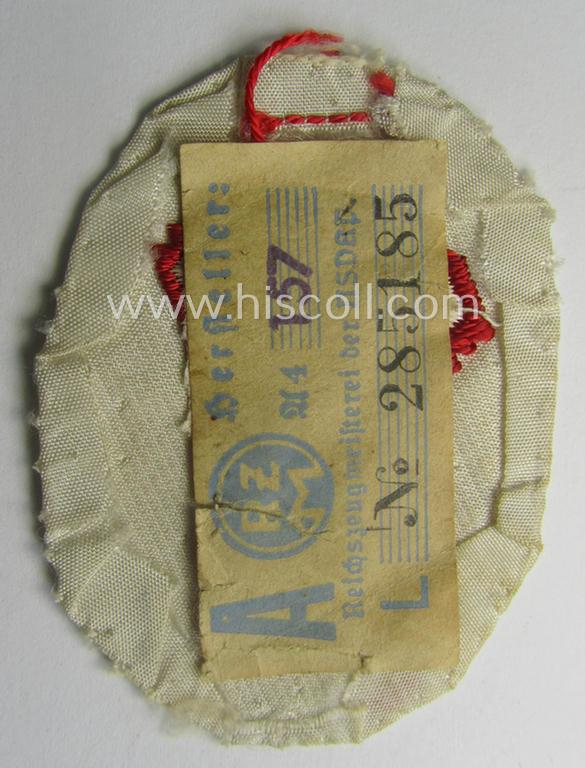 Truly used, HJ/BDM (ie. 'Hitlerjugend'/'Bund Deutscher Mädel') trade- or specialist-armbadge as executed in neat 'BeVo'-weave pattern as was intended for usage by a: 'Feldscher' (or: medical orderly) still retaining its period 'RzM'-etiket