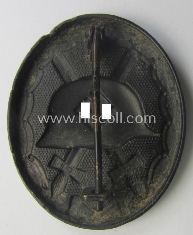 Neatly maker- (ie. '118'-) marked example of a black-class wound-badge (or: 'Verwundeten-Abzeichen in Schwarz') being an example that was produced by the (Austrian-based) maker (ie. 'Hersteller') named: 'August Menze & Sohn'