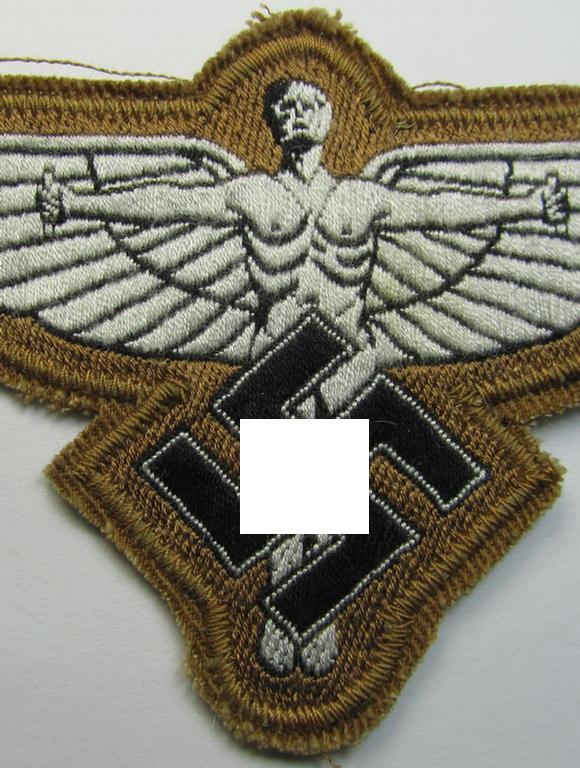 Tan-coloured, so-called: N.S.F.K.- (or: 'National Socialistisches Flieger Korps') breast-eagle being a nicely woven- (and enlisted-mens'-pattern) example that comes mounted on its piece of tan-coloured linnen