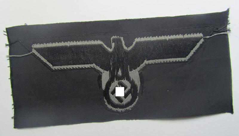 Later- (ie. mid-war-) period, WH (Heeres) 'Panzer'-type breast-eagle (ie. 'Brustadler für Panzertruppen') being a 'virtually mint- ie. unissued' example as executed in bluish-grey-coloured linnen on a black-coloured background