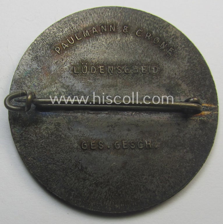 Commemorative, N.S.D.A.P.- (ie. WHW-) related 'tinnie' being a maker- (ie. 'Paulmann u. Crone'-) marked example depicting a portrait of Adolf Hitler surrounded by the text: 'Hitlers' Dank - Gau Westfalen-Nord - 1933-1934'