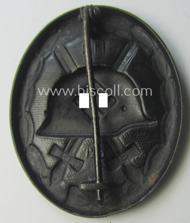 Dual-maker- (ie. 'E.H.'- and/or: '126'-) marked example of a black-class wound-badge (or: 'Verwundeten-Abzeichen in Schwarz') being an example that was produced by the maker (ie. 'Hersteller') named: 'Eduard Hahn'