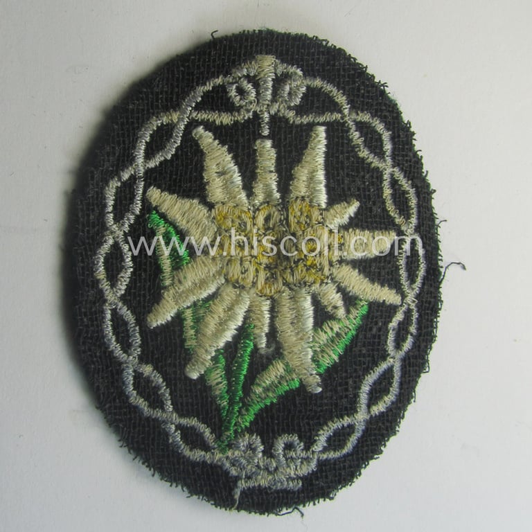 WH (Heeres) EM- (ie. NCO-) type: 'Edelweiss'-armpatch (being a typical machine-embroidered example)
