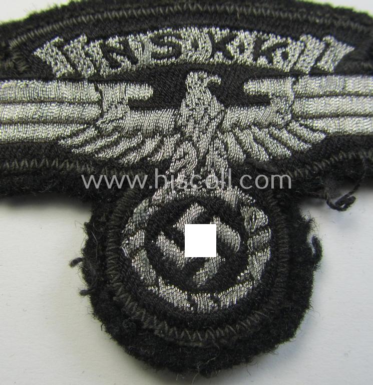Attractive, so-called: N.S.K.K. (ie. 'National Socialistisches Kraftfahr Korps') arm-eagle as executed in so-called: flatwire, 'BeVo'-weave pattern and comes mounted onto a black-coloured background