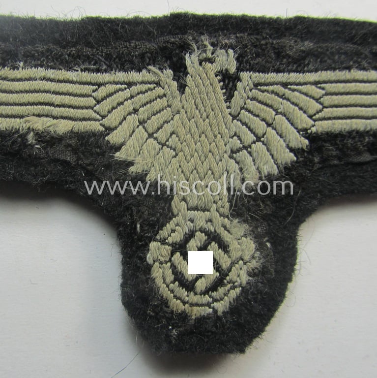 'Clearly used- and/or carefully tunic-removed ie. cut-out off a tunic' example of an 'SS' (ie. 'Waffen-SS') EM/NCO-type arm-eagle in 'BeVo'-woven-pattern