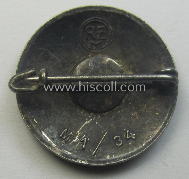 'N.S.D.A.P.'-membership-pin- ie. party-badge (or: 'Parteiabzeichen') which is maker-marked on its back with the makers'-designation: 'RzM' and/or: 'M1/34'