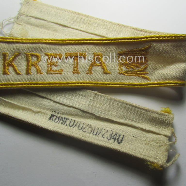WH cuff-title (ie. 'Ärmelstreifen') entitled: 'Kreta' (being an example that bears a printed 'RbN.'-numeral) and that comes in a surely issued albeit simply never worn nor once tunic-attached, condition