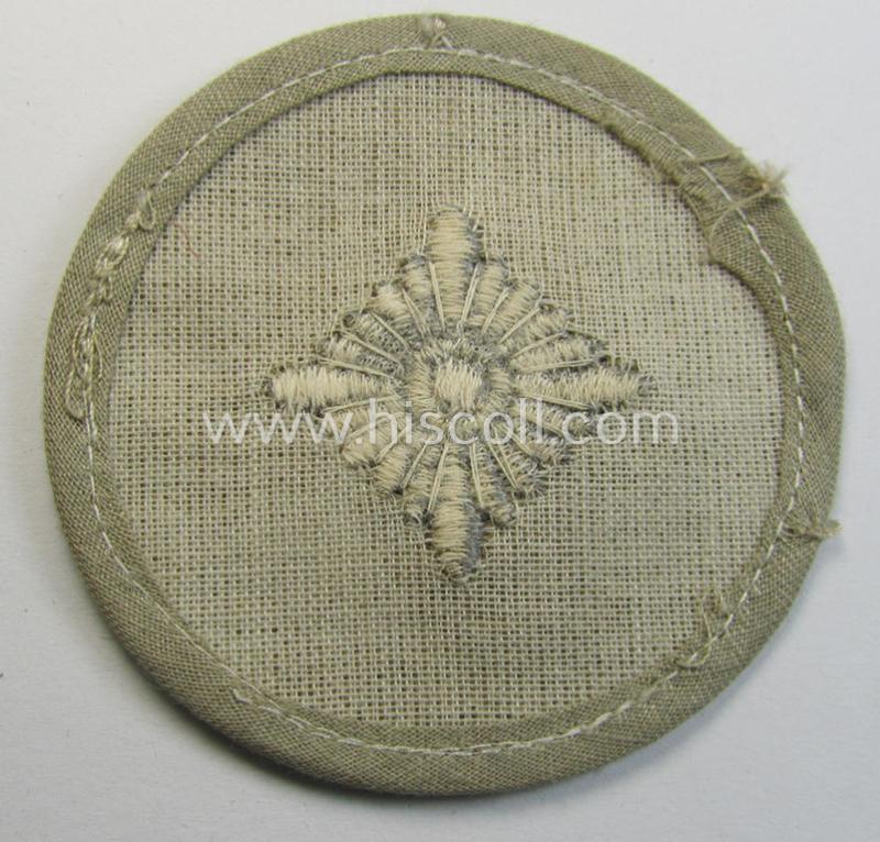 Attractive, WH (Heeres) rank-insignia (ie. arm-roundel) as was specifically intended for usage by an: 'Oberschütze' (being an interesting example as executed in silverish-grey-coloured linnen onto a 'HBT'-type, beige-coloured background)