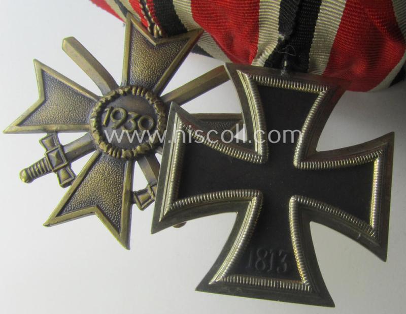 Two-pieced medal-bar (ie. 'Orden- o. Doppelspange') showing resp. an: 'Eisernes Kreuz II. Kl.' and a: 'Kriegsverdienstkreuz II. Klasse mit Schwn.' that both come period-mounted as a: 'Doppelspange'