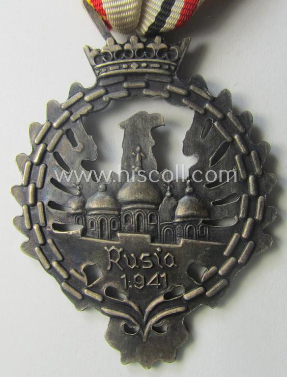 Attractive example of a Spanish-issued, campaign-medal of the Spanish Blue Division in Russia called: 'Medalla Conmemorativa Division Azul - Medalla de Tropa 1941' that comes mounted on its period ribbon as issued and/or worn