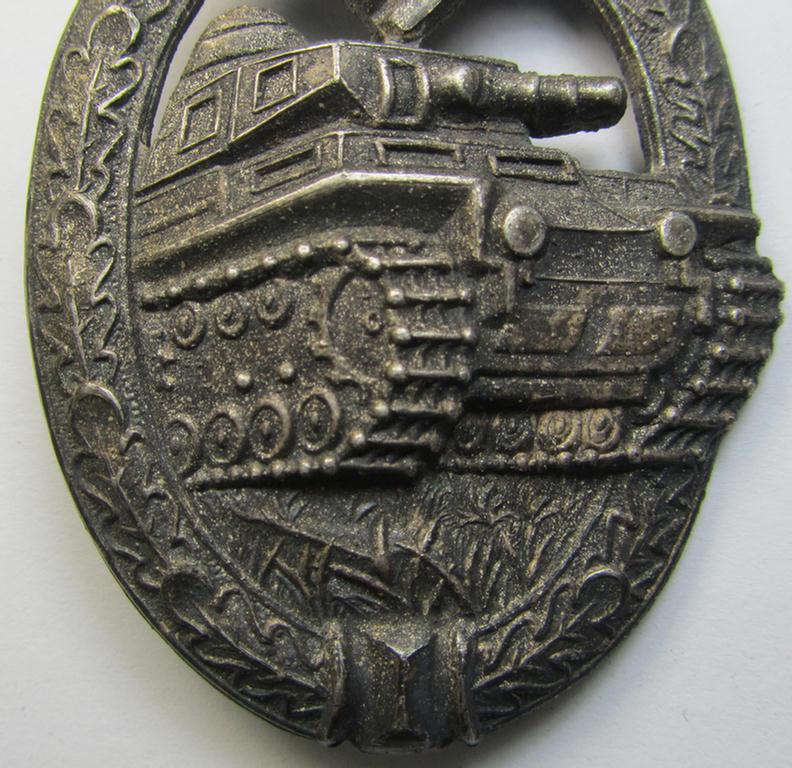 Attractive, 'Panzerkampfabzeichen in Silber' (or: silver-class panzer-assault badge or PAB) being a clearly maker- (ie. 'AS'-) marked- and/or zinc- (ie. 'Feinzink'-) based specimen, as was procuced by the: 'Adolf Scholze'- (ie. 'A.S.'-) com...