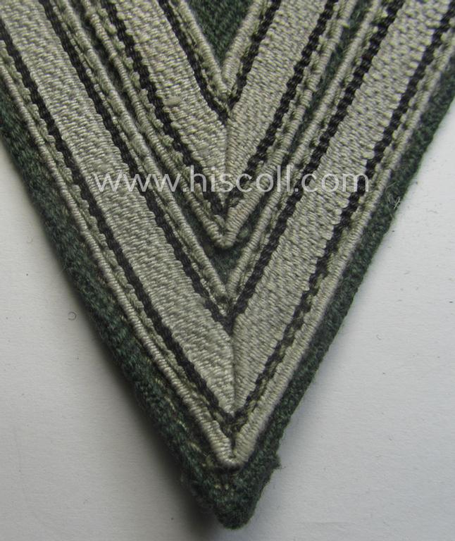 WH (Heeres ie. Waffen-SS) 'Armwinkel' (or: arm-chevron) as was executed on a greenish-coloured- and/or 'HBT'-like (ie. 'Drillich'-) based background as was specifically intended for usage by an: 'Obergefreiter' (ie. 'SS-Rottenführer')