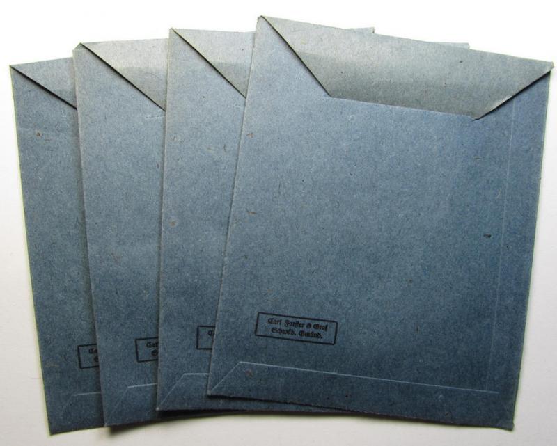 Neat, 'Zellstoff'-based medal-pouch, entitled: 'Eisernes Kreuz 2. Klasse 1939' being a darker-blue-coloured example as executed in typical: 'Zellstoff'-based paper, as was produced by the maker: 'Carl Forster & Graf'