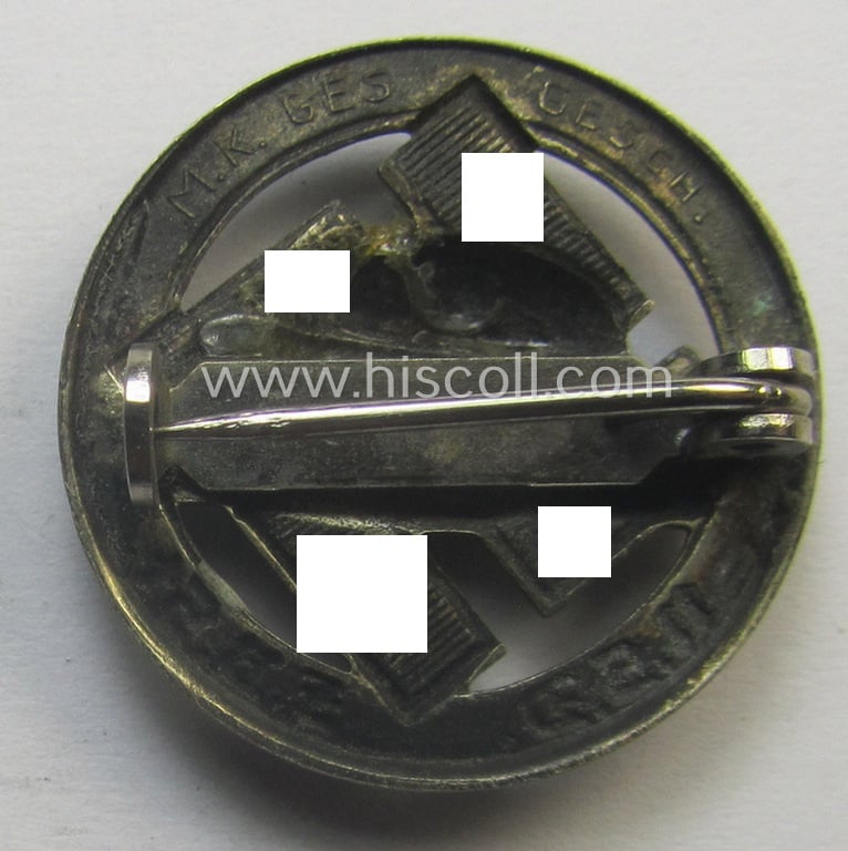 Membership lapel-pin: 'Nat. Soc. Deutscher Frontkämpferbund Stahlhelm' (or: 'N.S.D.F.B.St.') being a very detailed- and/or: maker- (ie. 'M.K. - 'Ges.Gesch'-) marked example that is executed in silver-toned 'Buntmetall'