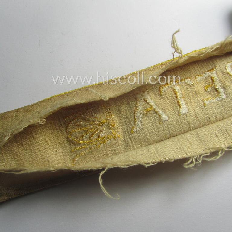 Truly worn WH cuff-title (ie. 'Ärmelstreifen') entitled: 'Kreta' (being an example that bears a printed 'RbN.'-numeral!) and that comes in a surely issued and/or carefully tunic-removed, condition