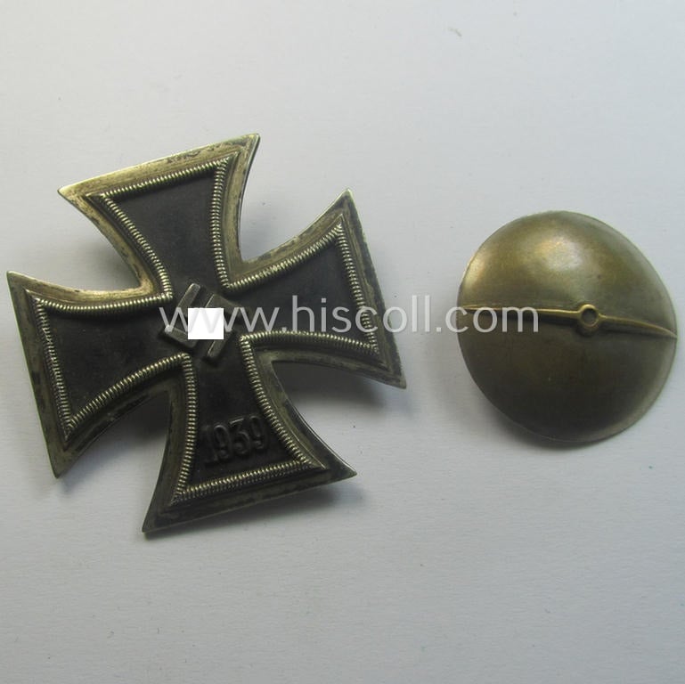 Moderately used, Iron Cross 1st class (or: 'Eisernes Kreuz 1. Klasse') as executed in the scarcely seen so-called: 'screw-back'- (ie. 'An der Schraube'-) pattern being a typical maker- (ie. 'L/16'-) marked example