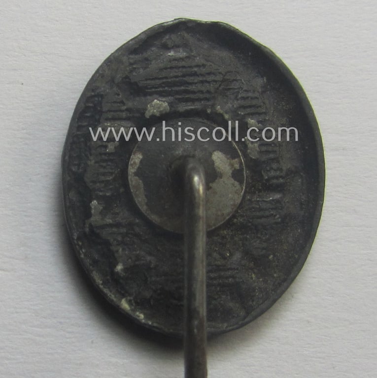 Neat - and 17 mm. sized! - miniature lapel-pin (ie. 'Halbminiatur') depicting a: 'Verwundeten-Abzeichen in Schwarz' (or: black-class wound-badge) being a non-maker-marked example