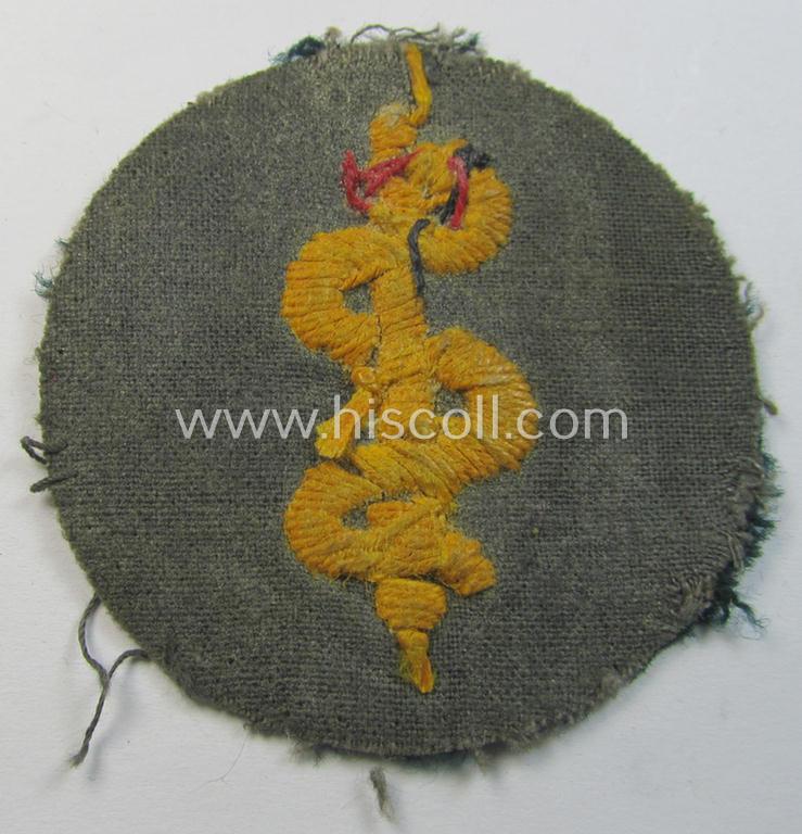 Neatly hand-embroidered - and truly used! - WH (Heeres) trade- and/or special-career insignia (ie.: 'Heeres-Tätigkeitsabzeichen') as was specifically intended for usage by: 'Sanitätspersonal' (or: medical orderlies- ie. staff)