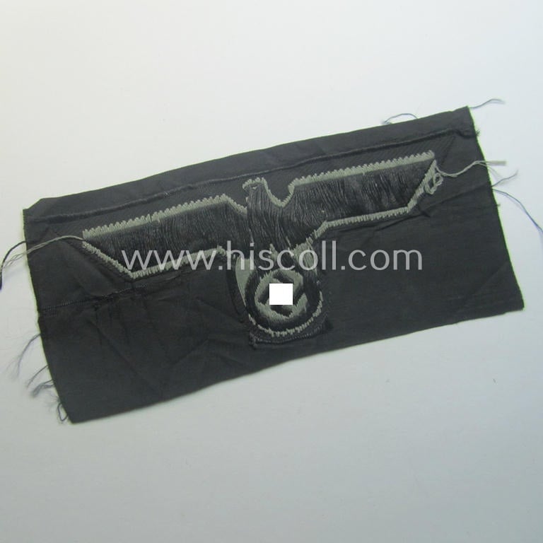 Later- (ie. mid-war-) period, WH (Heeres) 'Panzer'-type breast-eagle (ie. 'Brustadler für Panzertruppen') being a 'virtually mint- ie. unissued' example as executed in bluish-grey-coloured linnen on a black-coloured background