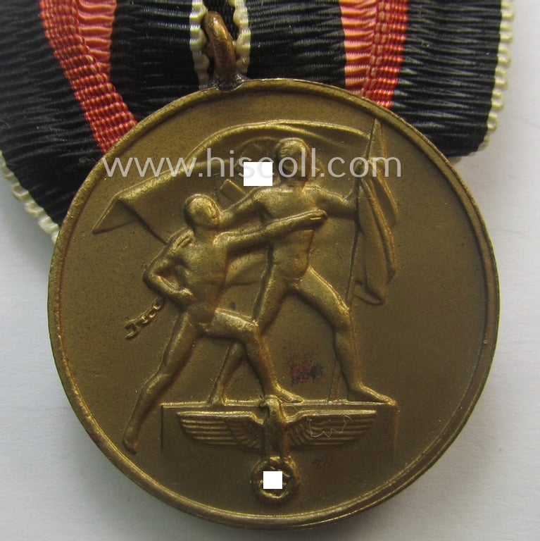 Bright golden-toned WH (Heeres o. KM etc.) so-called: 'Einzelspange' showing a WH Czech 'Anschluss'- (ie. occupation-) medal: '1 October 1938'