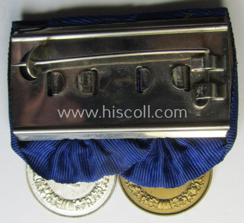 Attractive, two-pieced medal-bar (ie. 'Spange') showing two: WH (Heeres o. Kriegsmarine) so-called: 'Dienstauszeichnungen für 4 u. 12 Jahre Treue Dienste' that both come period-mounted as a so-called: 'Doppelspange'