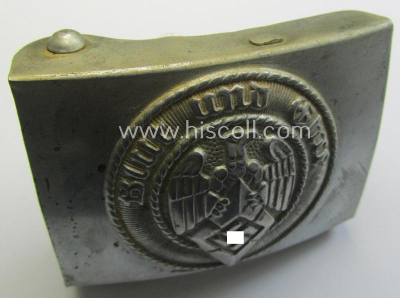 Attractive, HJ (ie. 'Hitlerjugend') silver-coloured- (ie. typically steel-based and 'crank-catch-variant'-pattern) belt-buckle being a neatly maker- (ie. 'RzM M4/42'-) marked example that comes in a just moderately used- ie. worn condition, as...