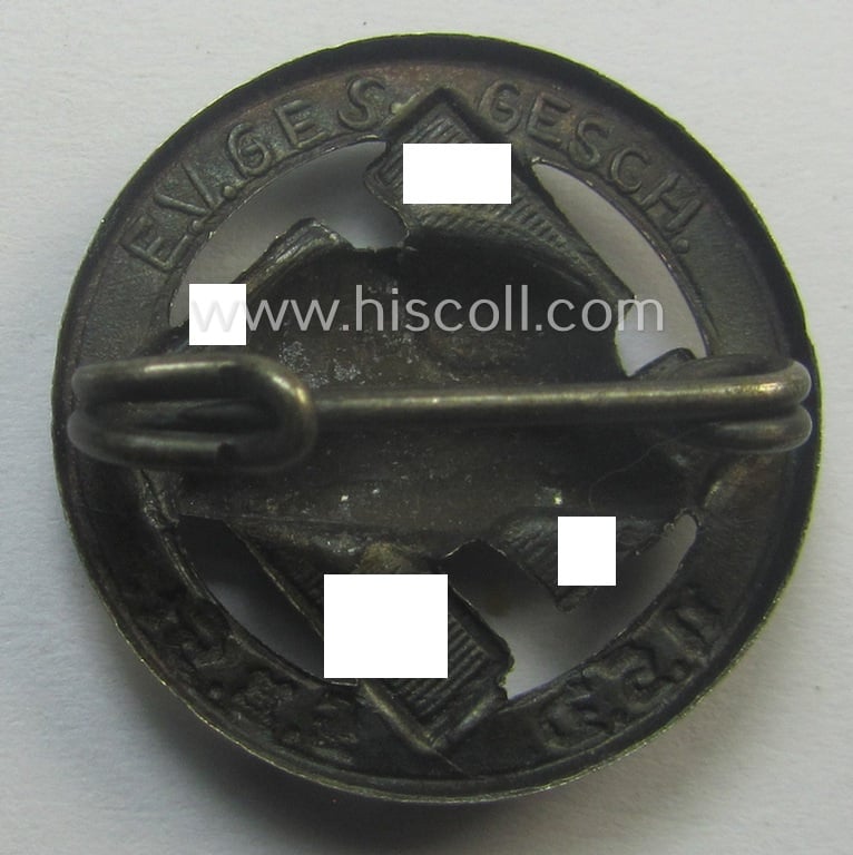 Membership lapel-pin: 'Nat. Soc. Deutscher Frontkämpferbund Stahlhelm' (or: 'N.S.D.F.B.St.') being a very detailed- and/or: maker- (ie. 'E.V. - 'Ges.Gesch'-) marked example that is executed in silver-toned 'Buntmetall'