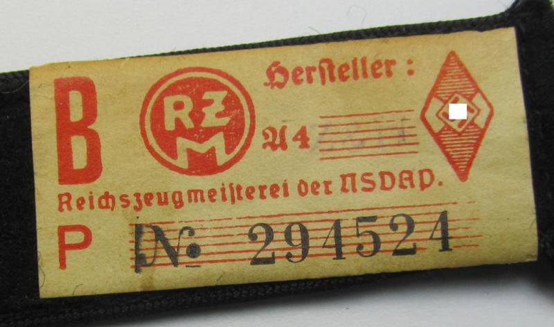 Neat - and naturally single! - black-piped 'DJ- o. Deutsches Jungvolk' shoulderstrap as was intended for usage by a: 'DJ-Mitglied' who served within the: 'Bann 742' (742 = 'Rappoltsweiler') and that comes with its period-attached 'RzM'-etik...