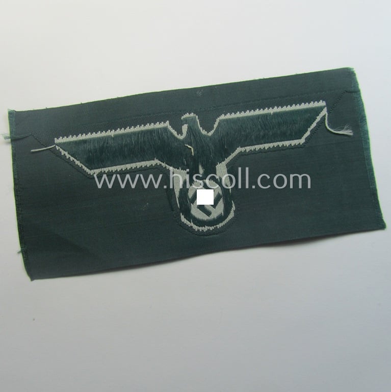 WH (Heeres) early- (ie. pre-war-) period- and/or greyish-coloured breast-eagle of the: 'M36'- (ie. 'M40'-) pattern as was executed in the 'BeVo'-weave pattern on a darker-green-coloured background