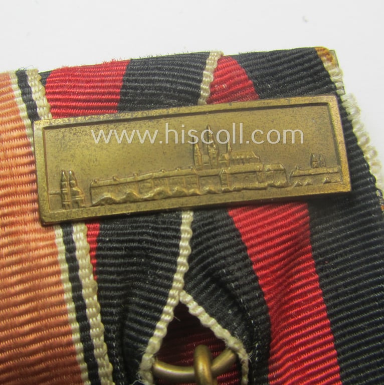 2-pieced, WH (Heeres o. Kriegsmarine) medal-bar (ie.: 'Doppelspange') showing resp. an Austrian and Czech 'Anschluss'-medal (which latter comes with a firmly attached 'Prager Burg-Spange')