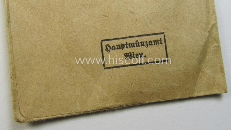 Attractive medal-set: 'Medaille für Deutsche Volkspflege' being a typical non-maker-maker-marked specimen that comes packed in its original pouch of issue by the: 'Hauptmünzamt Wien'-company as issued and/or recently found