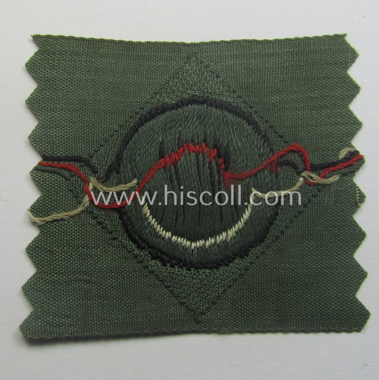 Early- (ie. mid-) war-period, WH (Heeres) cap-eagle & cocarde-set (ie. 'Schiffchenmützen-Adler u. Kokarde-Satz für Mannschaften u. Uffz.') being a 'virtually mint' set as executed in bluish-grey-coloured linnen on a field-grey-coloured background