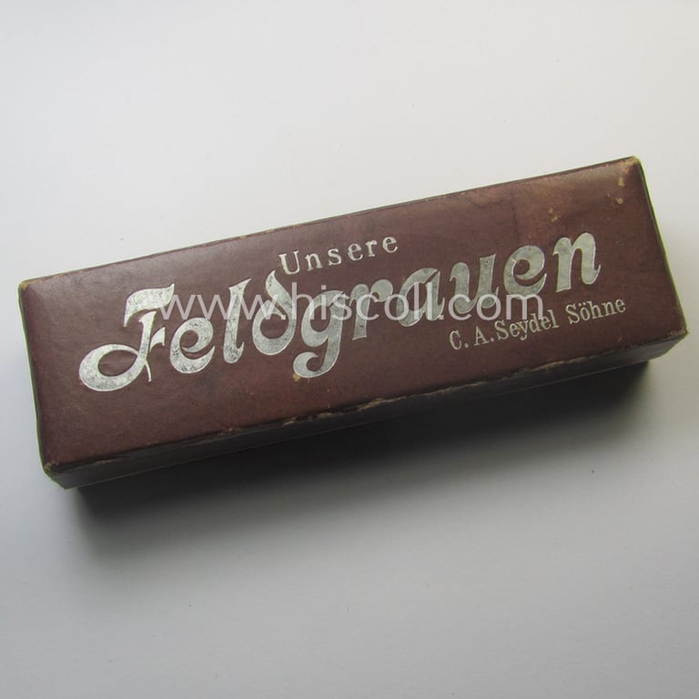 Neat, typical TR-era- (ie. 'Deutsche Wehrmacht'-) related harmonica entitled: 'Unsere Feldgrauen' that came stored in its original and/or carton-based box ie. etui