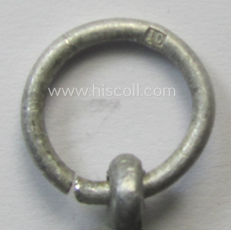 'Luftschutz-Ehrenzeichen 2. Stufe' being a maker- (ie. '10'-) marked example, as executed in (light-weight) aluminium-based metal and that came together with its period ribbon (ie. 'Bandabschnitt')