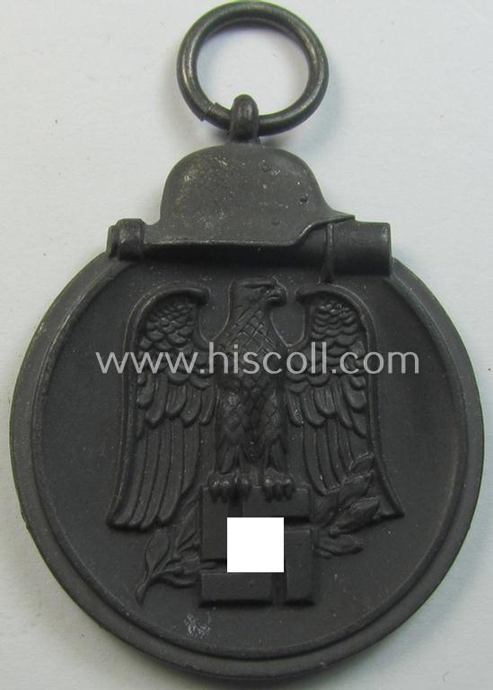 Neat medal-set: 'Winterschlacht im Osten 1941-42' being a non-maker-marked- (and/or typical 'Feinzink'-based) specimen that comes together with its (minimally confectioned) ribbon (ie. 'Bandabschnitt')