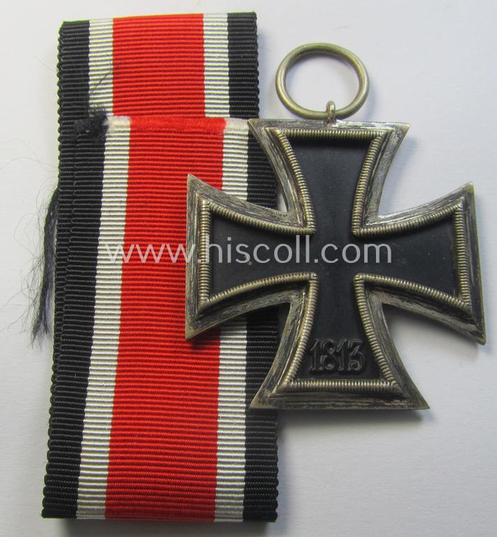 'Eisernes Kreuz II. Klasse' being a non-maker-marked example that comes together with its original- and once-mounted ribbon (ie. 'Bandabschnitt') as was produced by a (by me) unidentified maker (ie. 'Hersteller')