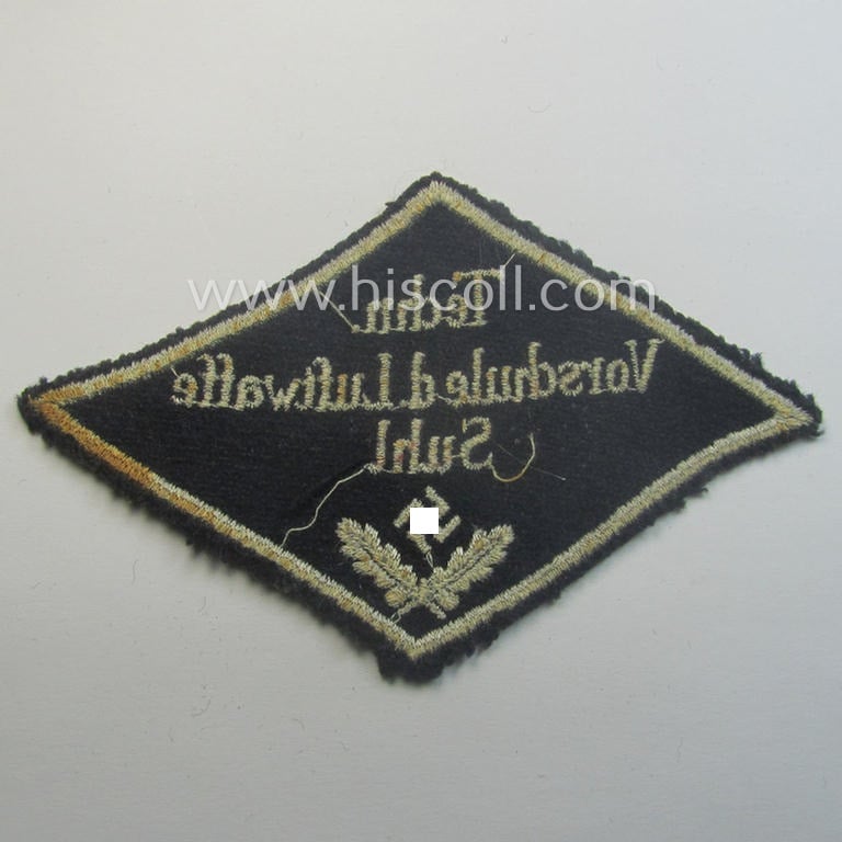 Unusual, HJ ('Hitlerjugend' ie. 'Flieger HJ'-) specialist armbadge (or: 'Schulabzeichen') depicting the text: 'Techn. Vorschule d. Luftwaffe - Suhl' and that comes in an overall nice- (ie. moderately used and/or tunic-removed-), condition