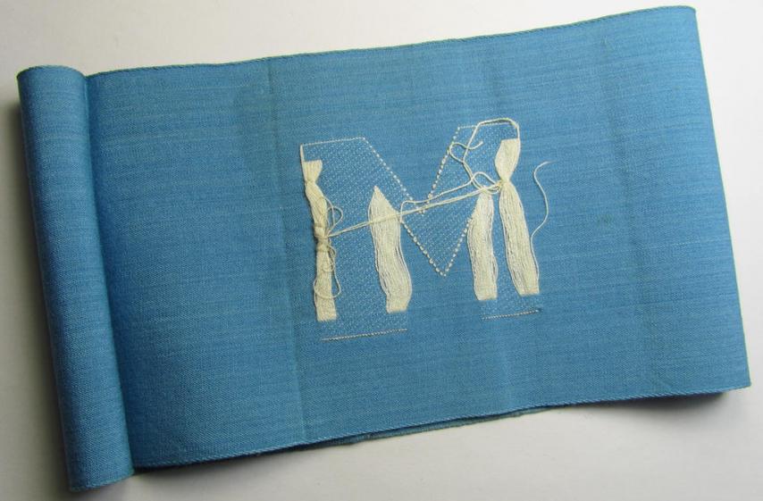 Linnen-based- and/or light-blue-coloured armband (ie. 'Armbinde') depicting an interwoven capital 'M'-character, as was presumably intended for staff-members of the German RLB (ie. 'Reichsluftschutz-Bund')