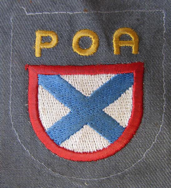 Very nice - and actually scarcely encountered! - multi-coloured and machine-embroidered- (ie. 'variant'-type) armshield as was intended for a Russian volunteer of the 'Russian Liberation Army' (ie. 'POA')